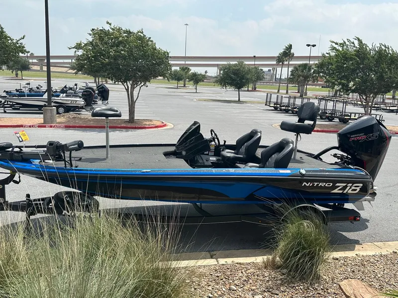 Slide: The Image of 2023 Nitro Z18 fishing boat parked in a lot. - 3