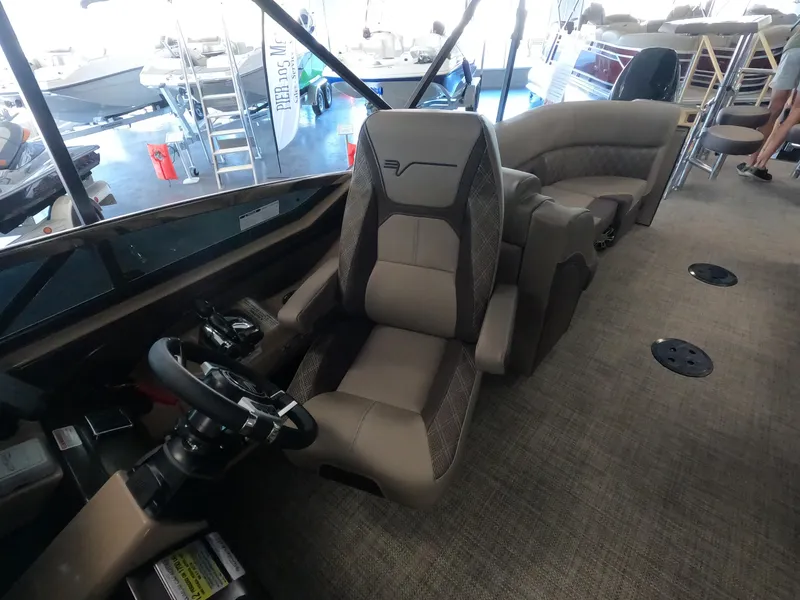 Slide: The Image of 2023 Vanderbilt 700T boat interior with captain's chair and passenger seating. - 10
