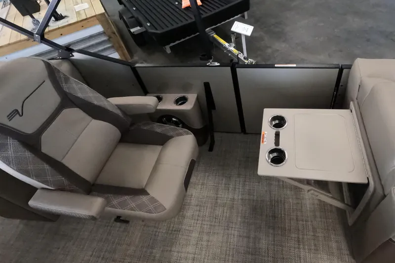 Slide: The Image of 2023 Vanderbilt 700T boat interior with comfortable seating and cup holders. - 12