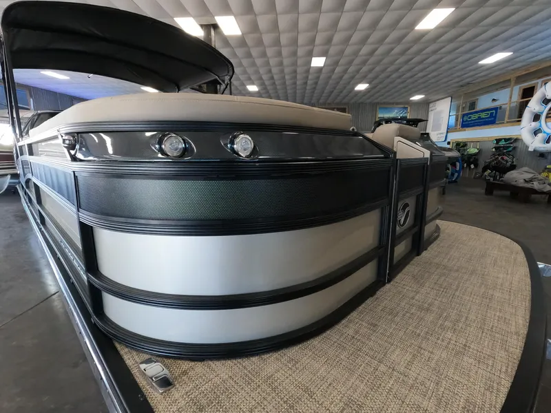 Slide: The Image of 2023 Vanderbilt 700T pontoon boat in showroom, front view. - 23