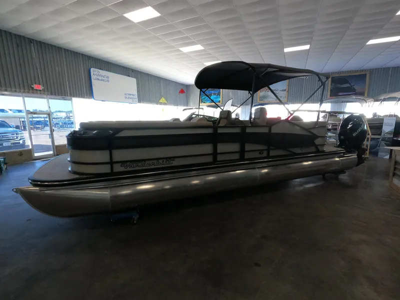 Slide: The Image of 2023 Vanderbilt 700T pontoon boat in showroom. - 24
