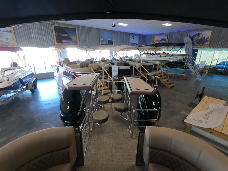 Slide: The Image of Showroom displaying 2023 Vanderbilt 700T boats with seating and engines. - 4