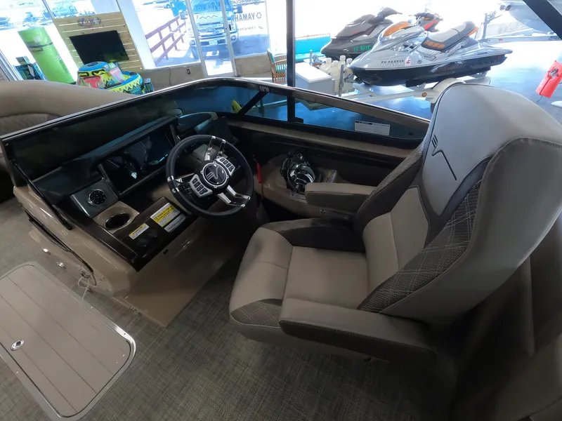 Slide: The Image of Interior of a 2023 Vanderbilt 700T boat with modern steering console and comfortable seating. - 8