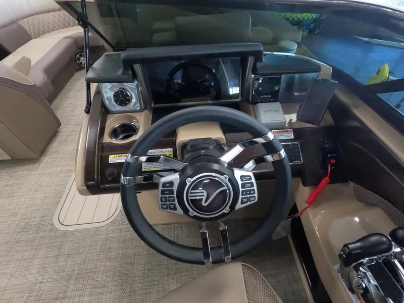 Slide: The Image of Steering console of a 2023 Vanderbilt 700T boat with modern controls and dashboard. - 9