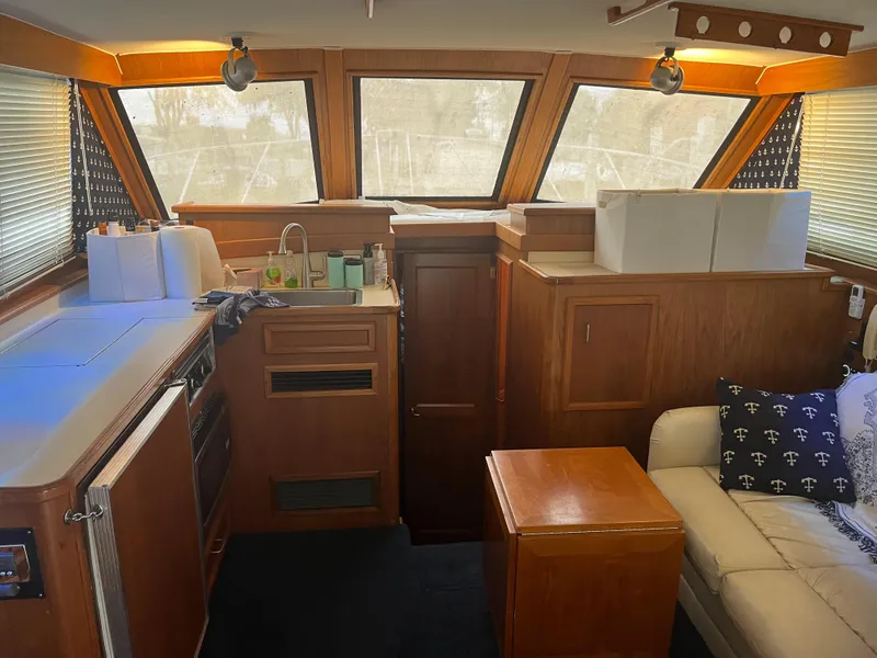 Slide: The Image of Interior of 1989 Egg Harbor 33 Sedan with kitchen and seating area. - 22