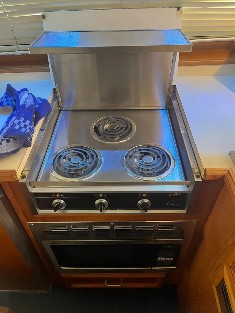 Slide: The Image of Electric stove and oven in 1989 Egg Harbor 33 Sedan boat kitchen. - 24