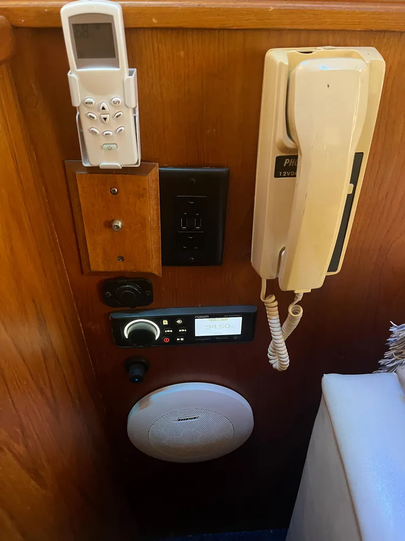 Slide: The Image of 1989 Egg Harbor 33 Sedan interior with vintage phone and control panel. - 30