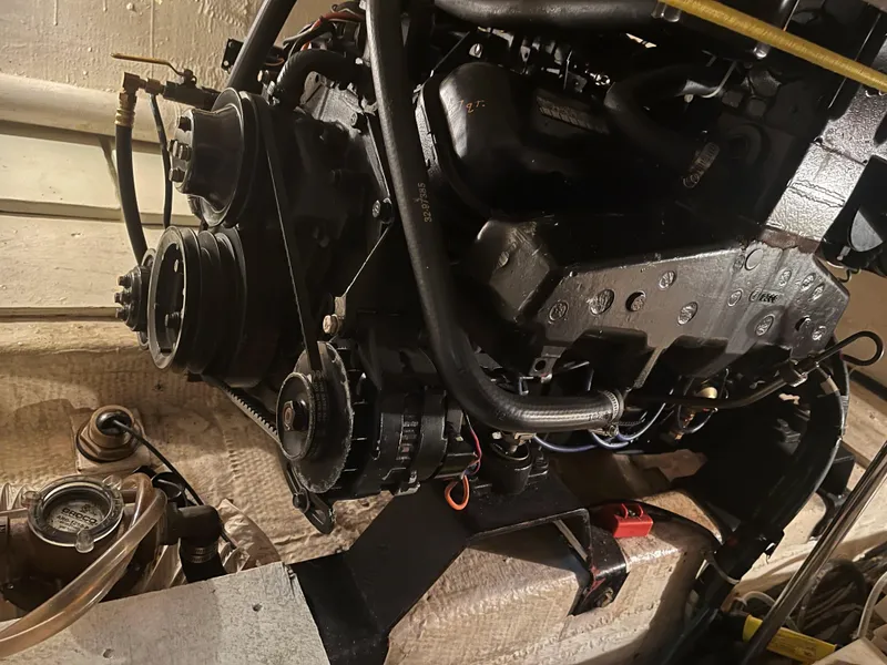 Slide: The Image of Engine of a 1989 Egg Harbor 33 Sedan boat, showcasing mechanical components. - 35