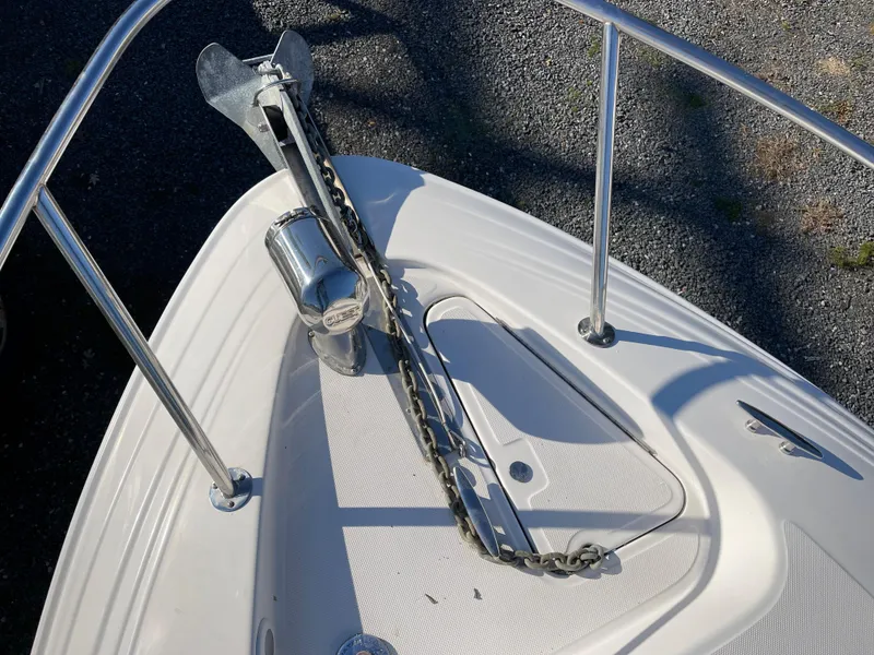 Slide: The Image of 2006 Regal 2665 Commodore boat anchor and chain on deck. - 23