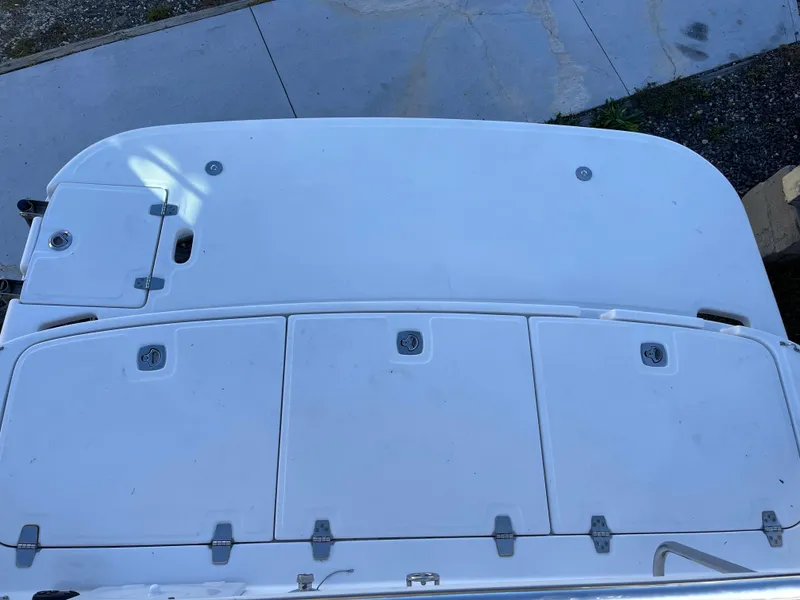 Slide: The Image of 2006 Regal 2665 Commodore boat deck with storage compartments. - 25