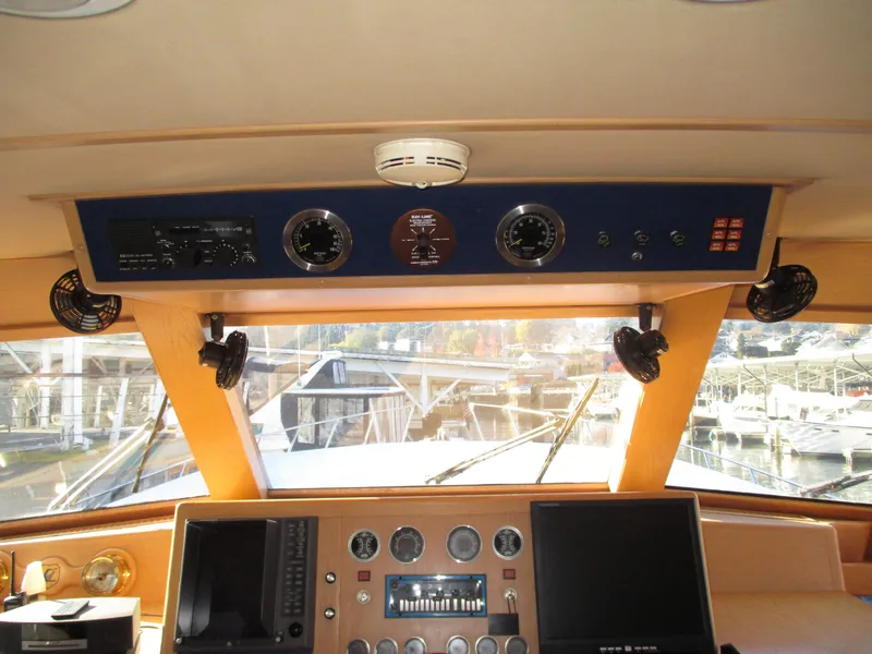 Slide: The Image of 1984 McQueen Flush Deck Motoryacht helm with navigation instruments and dual monitors. - 35