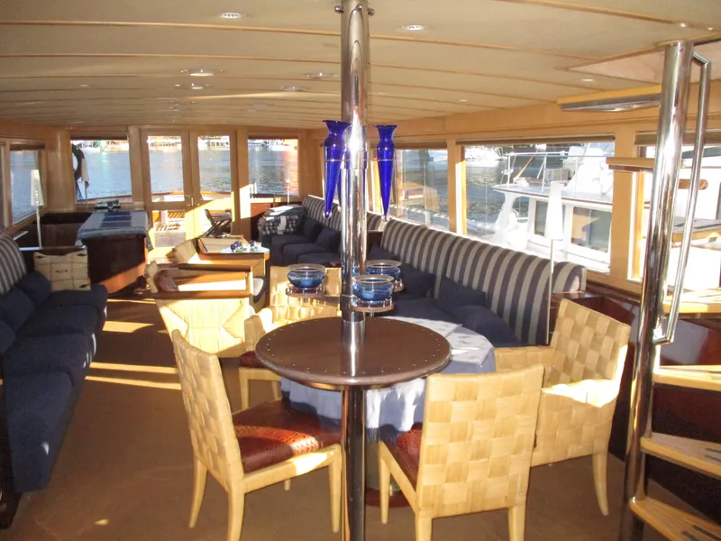 Slide: The Image of Luxurious interior of 1984 McQueen Flush Deck Motoryacht with elegant seating and dining area. - 38