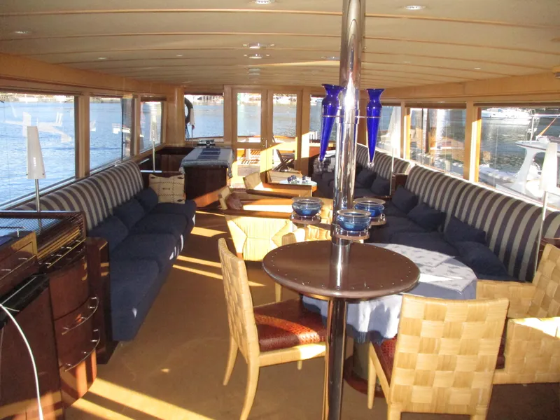 Slide: The Image of Luxurious interior of a 1984 McQueen Flush Deck Motoryacht with elegant seating and decor. - 39