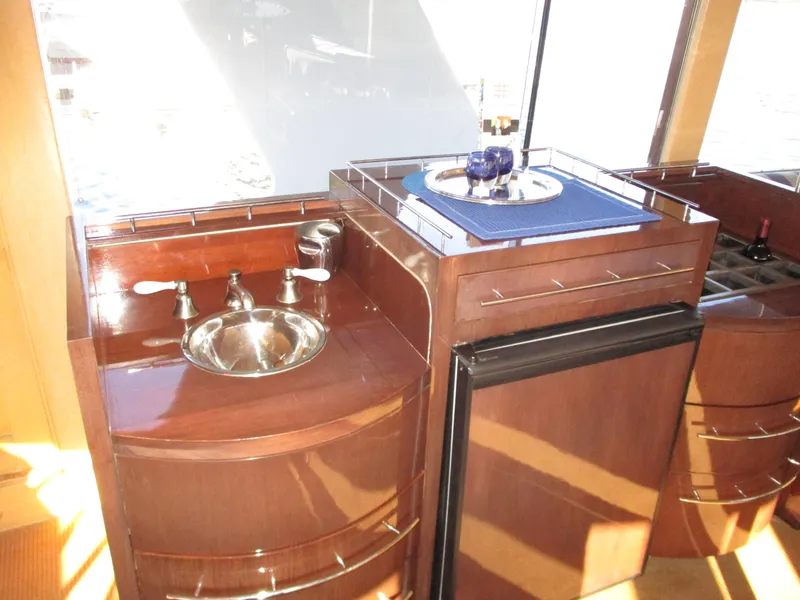 Slide: The Image of Luxurious 1984 McQueen Flush Deck Motoryacht interior with sink and mini fridge. - 43