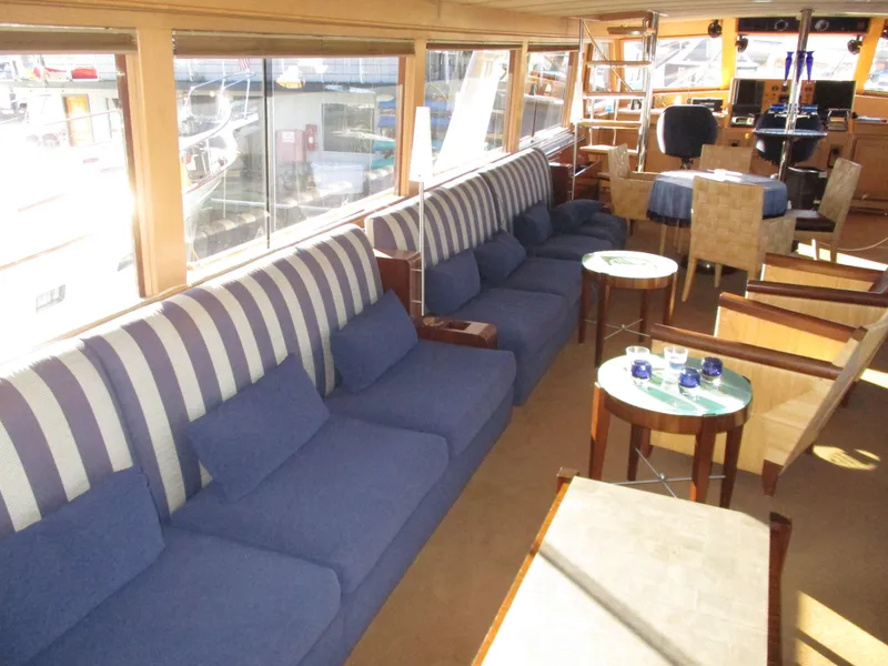 Slide: The Image of Luxurious interior of 1984 McQueen Flush Deck Motoryacht with blue seating and elegant decor. - 45