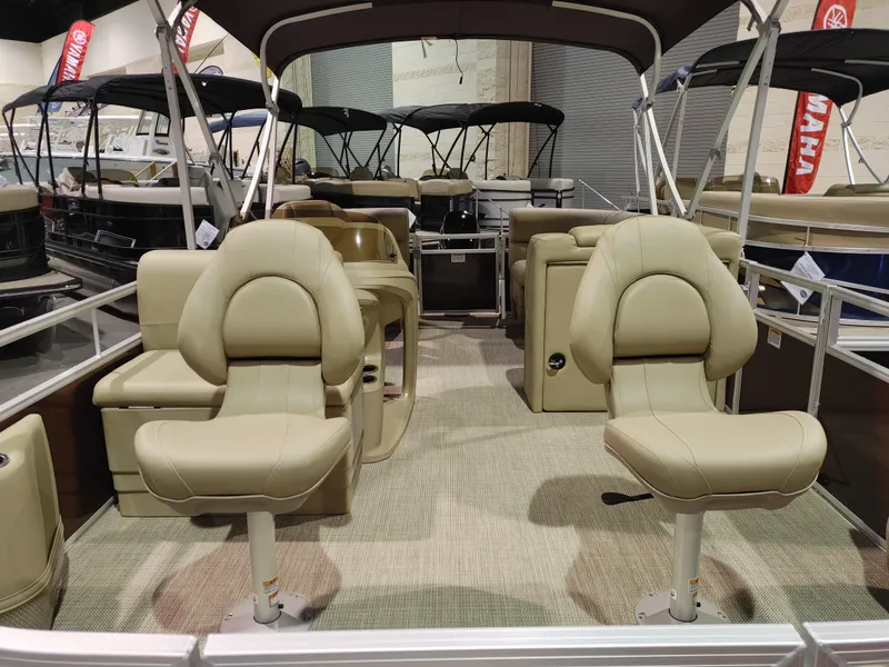 Slide: The Image of 2024 Starcraft EX 18 F pontoon boat with beige seating and canopy. - 7