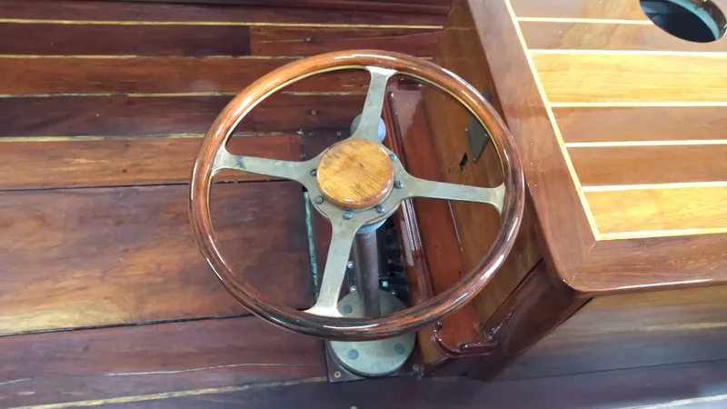 Slide: The Image of Vintage 1990 Custom 29 Launch wooden boat steering wheel and dashboard. - 13