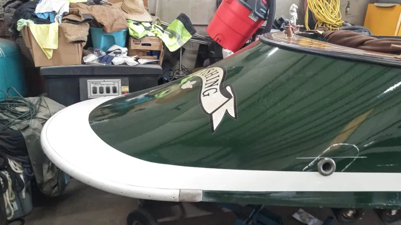 Slide: The Image of Custom 1990 29 Launch boat in a cluttered garage. - 15