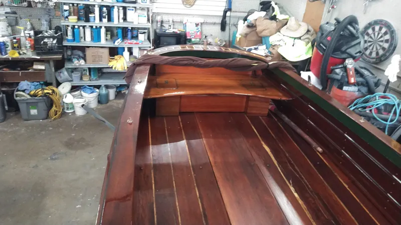 Slide: The Image of Custom 1990 29 Launch wooden boat interior in a workshop. - 2