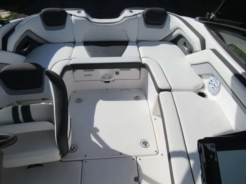 Slide: The Image of 2015 Yamaha Boats AR192 interior seating area with white and black upholstery. - 19