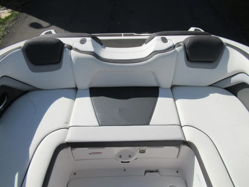 Slide: The Image of 2015 Yamaha Boats AR192 rear seating area with white and black upholstery. - 20