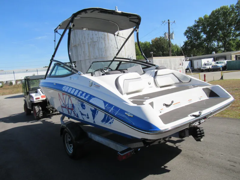 Slide: The Image of 2015 Yamaha Boats AR192 on trailer, rear view with bimini top. - 3