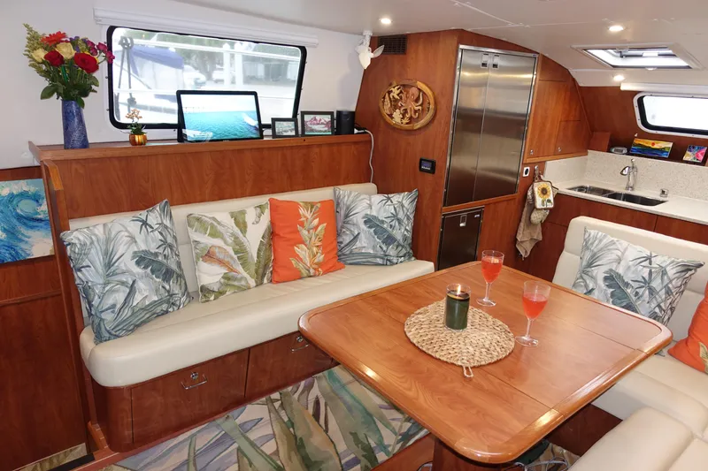 Slide: The Image of Luxurious interior of 2019 Endeavour Catamaran 440 HYBRID with cozy seating and vibrant decor. - 10