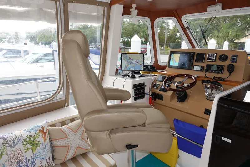 Slide: The Image of Interior helm station of 2019 Endeavour Catamaran 440 HYBRID with navigation equipment. - 13