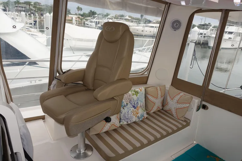 Slide: The Image of Captain's chair and seating area inside 2019 Endeavour Catamaran 440 HYBRID. - 14