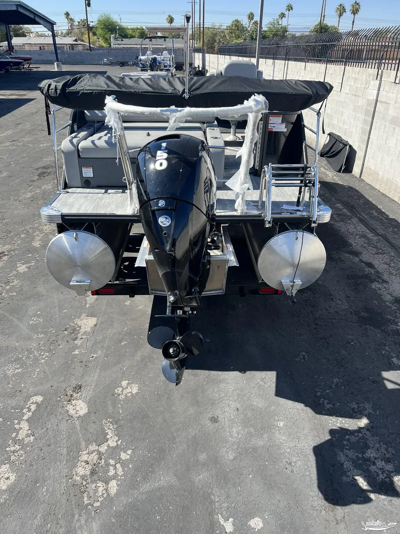 Slide: The Image of 2023 Crest 240 Classic Platinum pontoon boat with powerful outboard motor. - 2