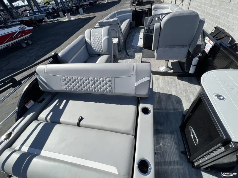 Slide: The Image of 2023 Crest 240 Classic Platinum boat interior with luxurious gray seating and modern design. - 4