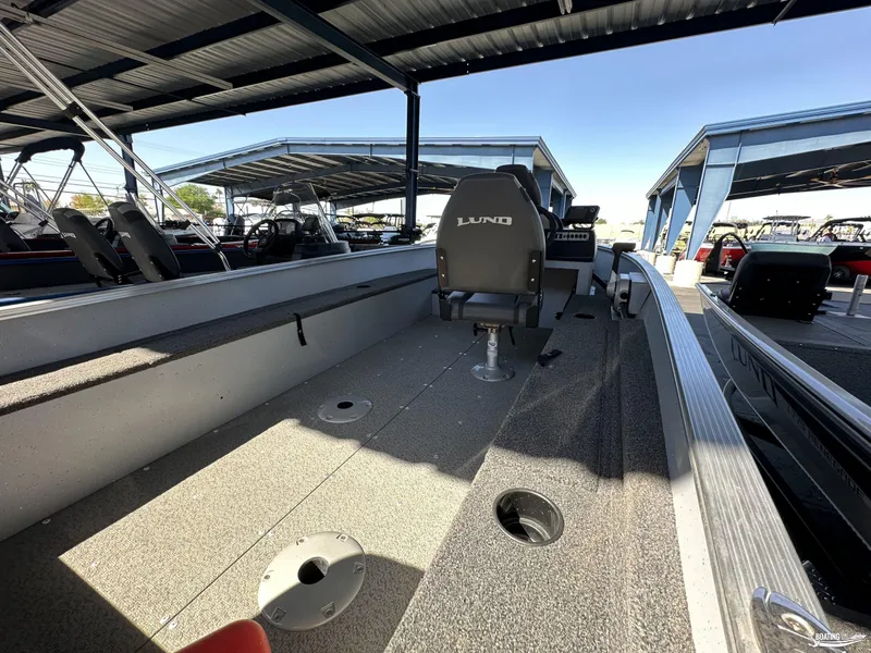 Slide: The Image of 2023 Lund Fury 1600 SS fishing boat interior under covered dock. - 8