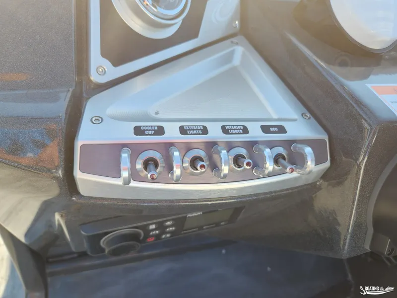 Slide: The Image of Control panel of 2023 Crest Caribbean RS 250 SLS boat with labeled switches. - 11
