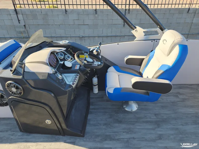 Slide: The Image of 2023 Crest Caribbean RS 250 SLS boat cockpit with modern steering and comfortable seating. - 13