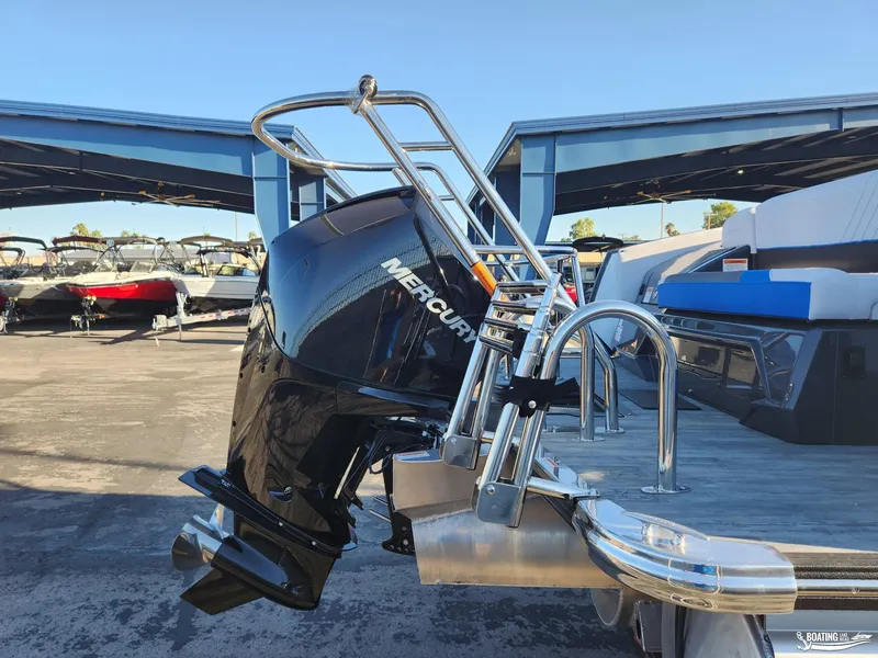 Slide: The Image of 2023 Crest Caribbean RS 250 SLS boat with Mercury outboard engine in marina. - 4