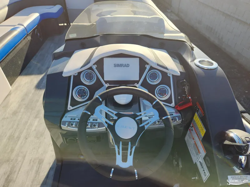 Slide: The Image of 2023 Crest Caribbean RS 250 SLS boat dashboard with steering wheel and controls. - 7