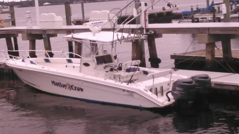 Slide: The Image of Al Dhaen 360 Open Fisher 2000 boat docked at marina with twin Yamaha outboard engines. - 16
