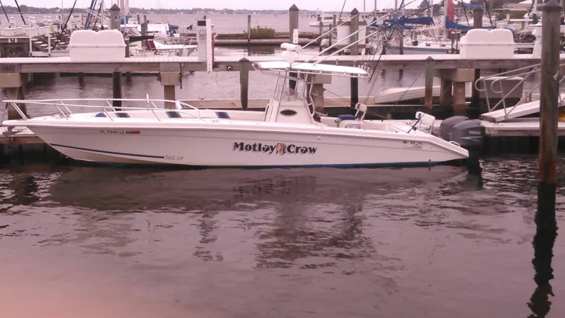 Slide: The Image of 2000 Al Dhaen 360 Open Fisher boat docked at marina, named Motley Crew. - 17