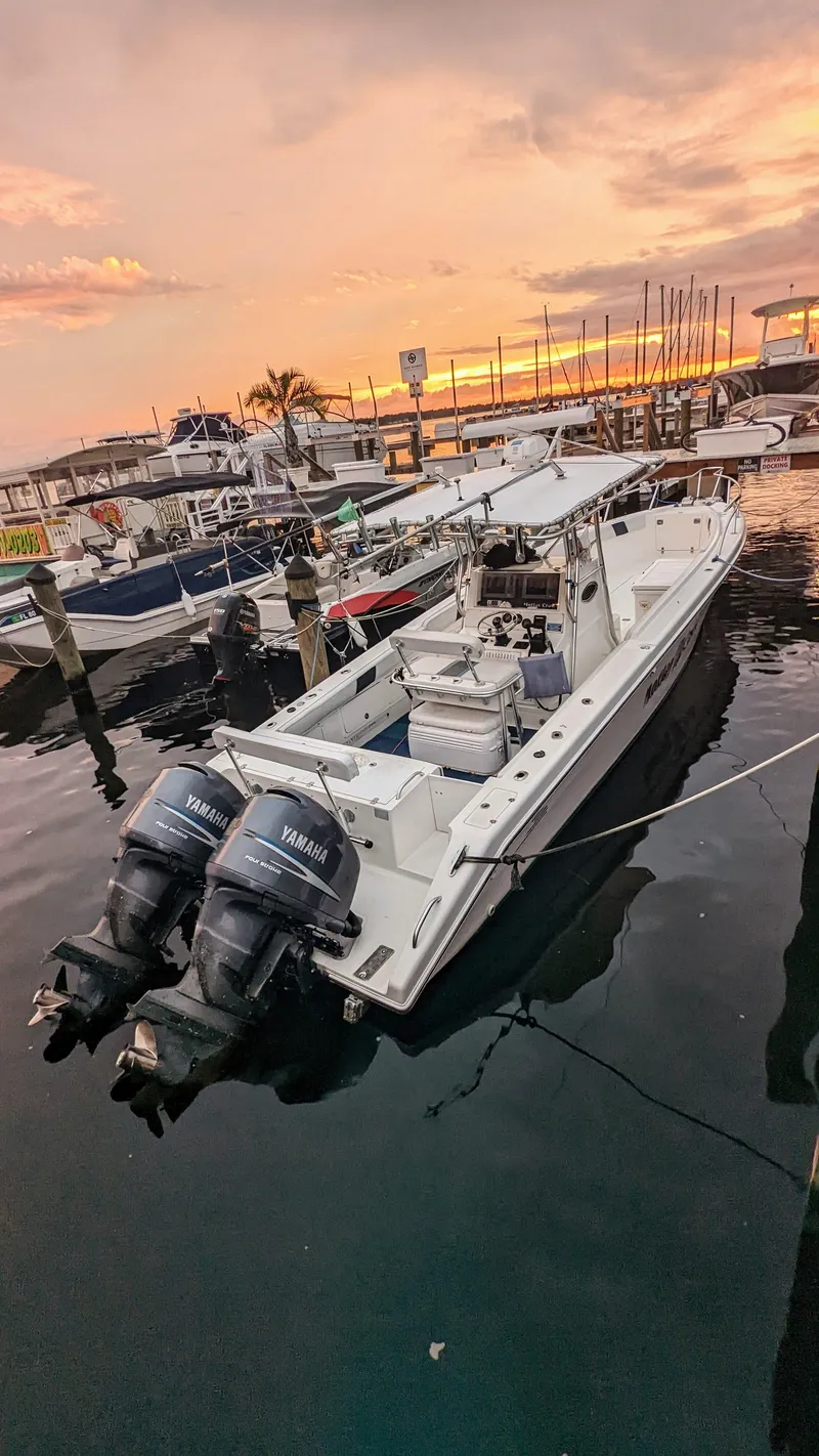 Slide: The Image of 2000 Al Dhaen 360 Open Fisher boat docked at sunset with twin Yamaha outboard motors. - 18
