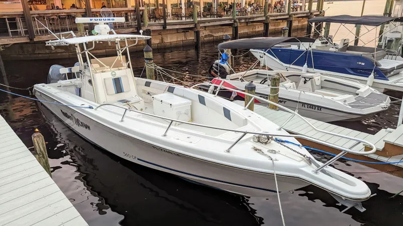 Slide: The Image of 2000 Al Dhaen 360 Open Fisher boat docked at a marina. - 2