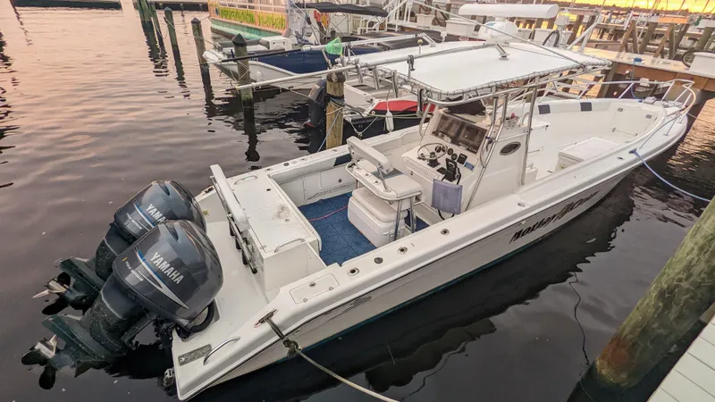 Slide: The Image of 2000 Al Dhaen 360 Open Fisher boat docked with twin Yamaha outboard engines. - 4