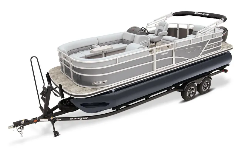Slide: The Image of 2023 Ranger Reata 223C pontoon boat on trailer, featuring sleek design and spacious seating. - 6
