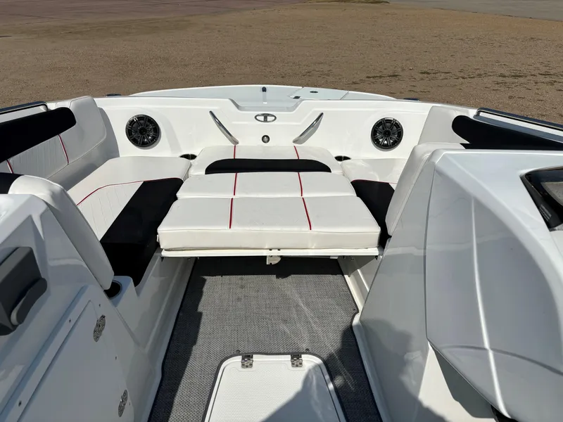 Slide: The Image of 2023 Tahoe 1950 boat interior with white seating and speakers. - 10