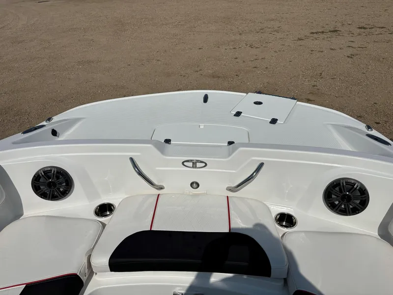 Slide: The Image of 2023 Tahoe 1950 boat interior with seating and speakers. - 13