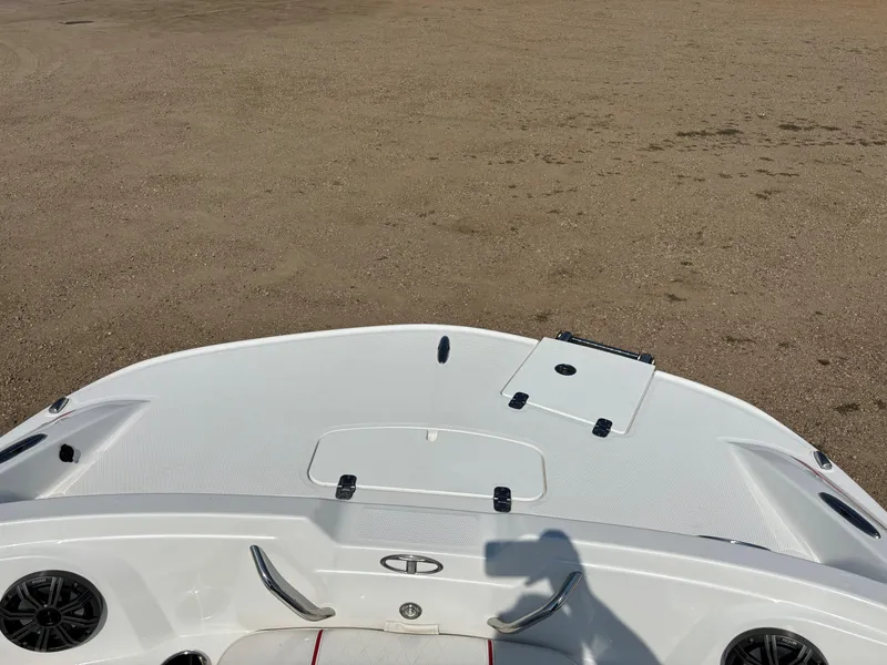 Slide: The Image of Tahoe 1950 boat deck, 2023 model, on sandy terrain. - 14