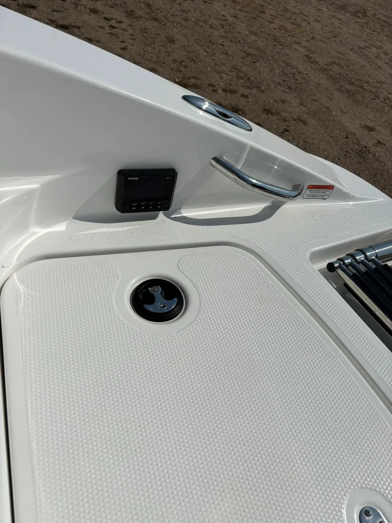 Slide: The Image of 2023 Tahoe 1950 boat deck with control panel and handle. - 23