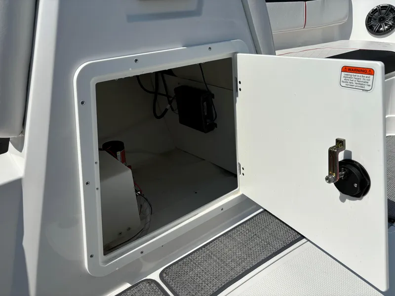 Slide: The Image of Open storage compartment on 2023 Tahoe 1950 boat, showing interior details. - 26