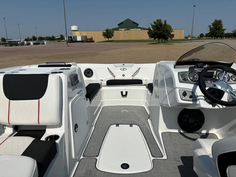 Slide: The Image of 2023 Tahoe 1950 boat interior with modern dashboard and seating. - 9