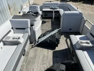 Slide: The Image of 2023 Sweetwater 2086C pontoon boat interior with seating and accessories. - 1