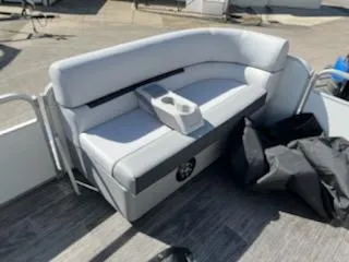 Slide: The Image of Sweetwater 2086C 2023 model boat with cushioned seating and cup holders. - 3